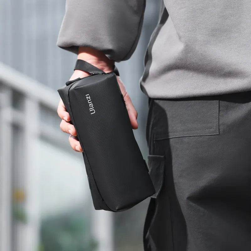 Ulanzi PK-04 carrying bag for DJI Osmo Pocket 3, held. Black case with Ulanzi logo.