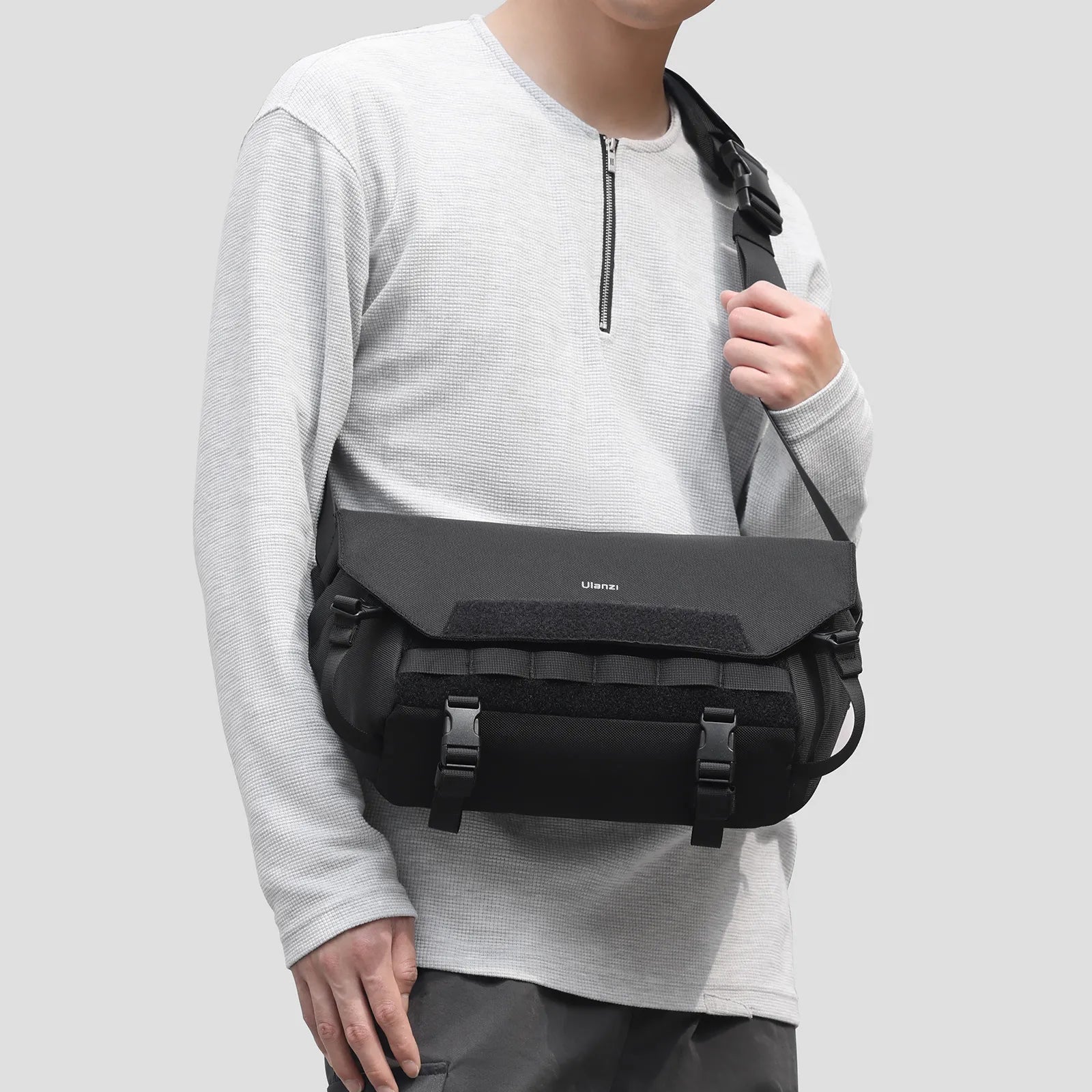 Ulanzi BC08 Camera Sling Bag on person. Featuring adjustable strap, black color, and Ulanzi logo.