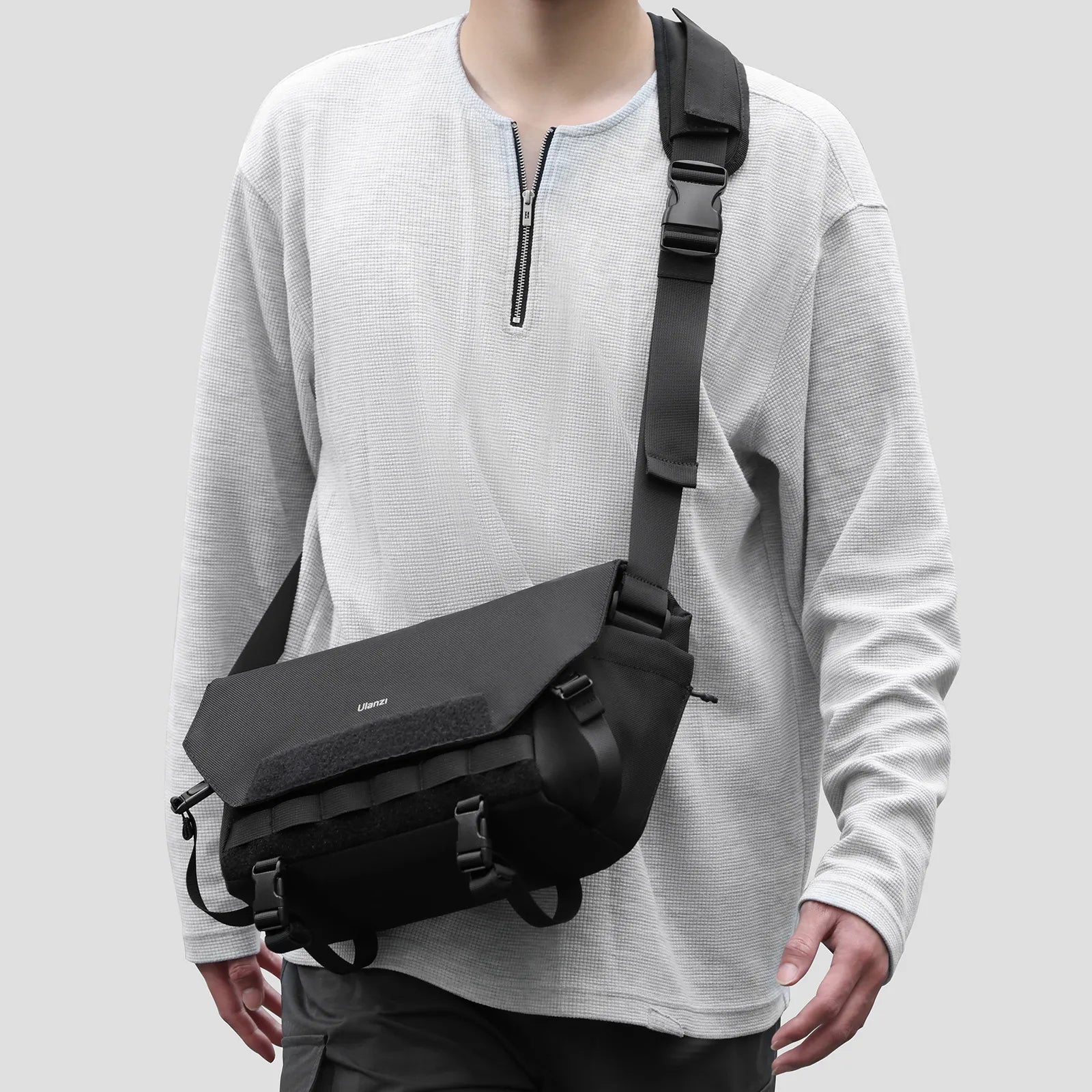 Ulanzi BC08 Camera Sling Bag in black worn, featuring adjustable strap and modular design.