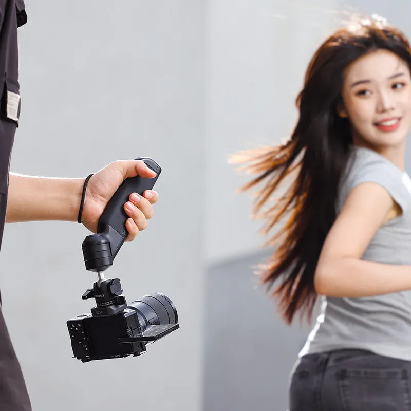 Ulanzi TT38 tripod held by a person with camera, ideal for vlogging, fast delivery.