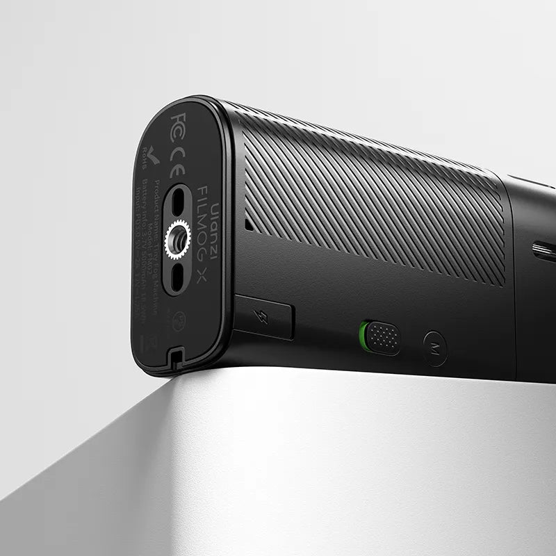 Close-up of the bottom side of a Ulanzi portable fog machine showing its connection port and textured grip.