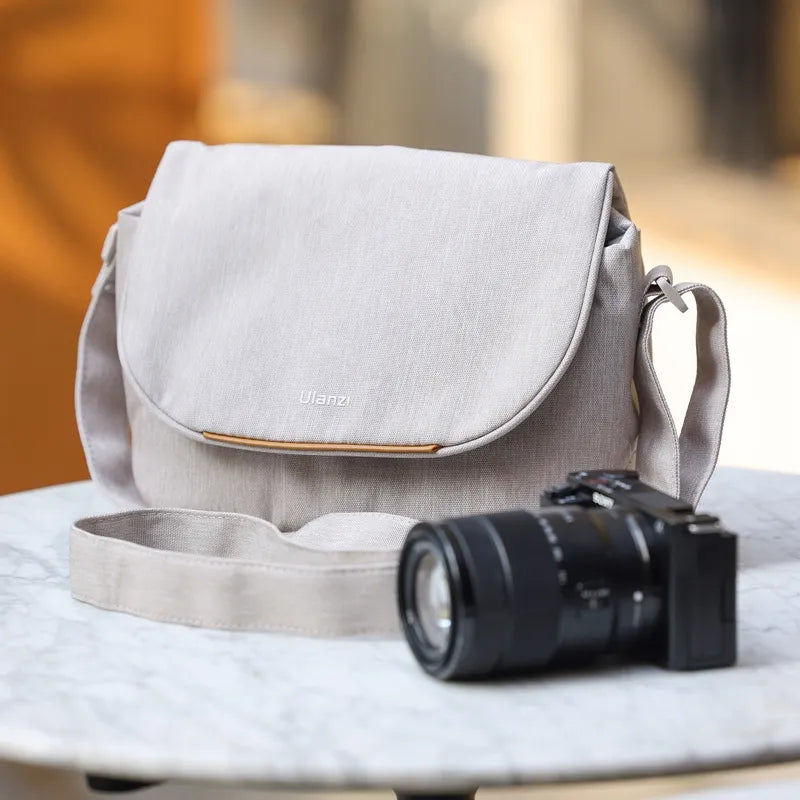Ulanzi F01 Camera Sling Bag B011 in beige with a camera, perfect for creators.