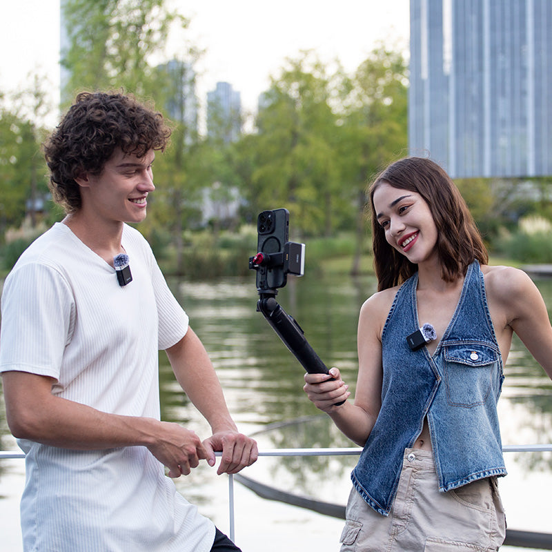 Ulanzi U-Mic AM18 Wireless Lavalier Microphone System in use outdoor, content creation.