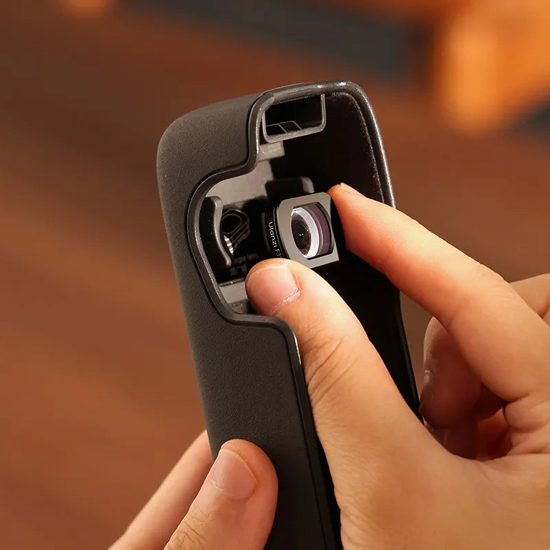 Ulanzi 112° Wide-Angle Lens being installed in a phone case, black design, ideal for creators.