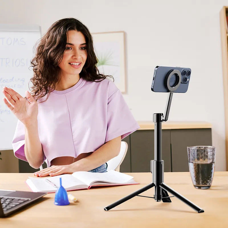Woman using Ulanzi MG-003 Magnetic Phone Selfie Stick Tripod Pro for vlogging indoors, black.