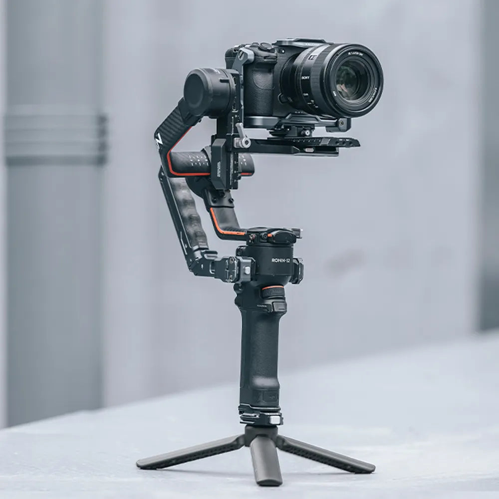 Black camera stabilizer with attached camera, Ronin-S2, ideal for stable videography.