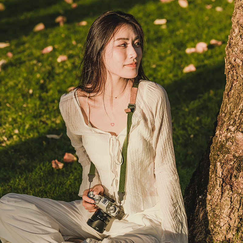 Ulanzi Falcam Maglink shoulder strap: comfortable camera strap, shown on woman outdoors.