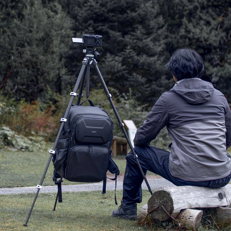 Ulanzi TT09 Carbon Fiber Travel Tripod setup for travel video shooting, with backpack.