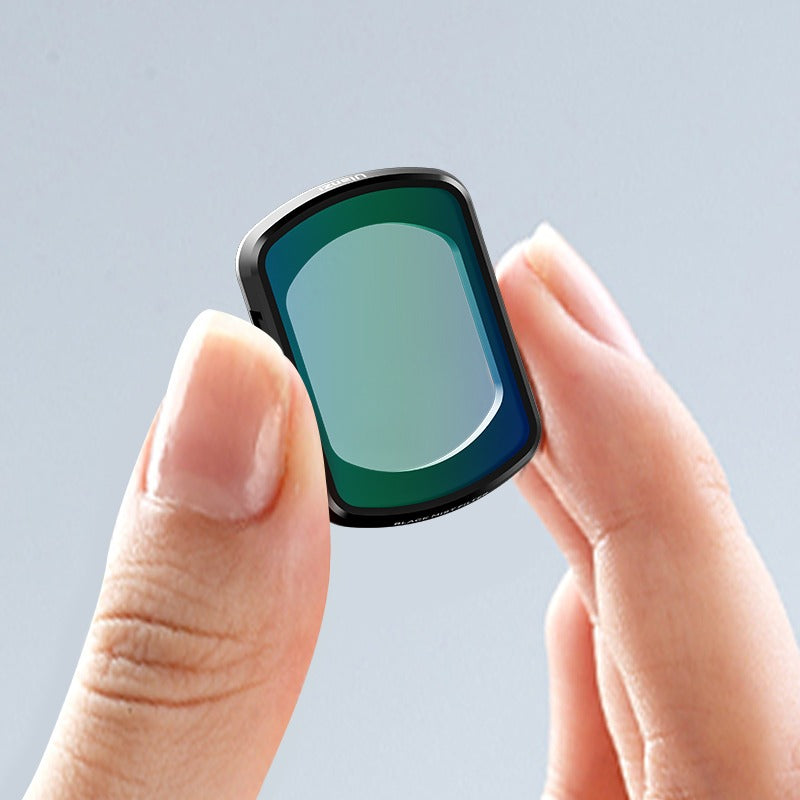 Ulanzi PK-01 Black Mist Filter for DJI Osmo Pocket 3 held in hand, showing filter glass and frame.