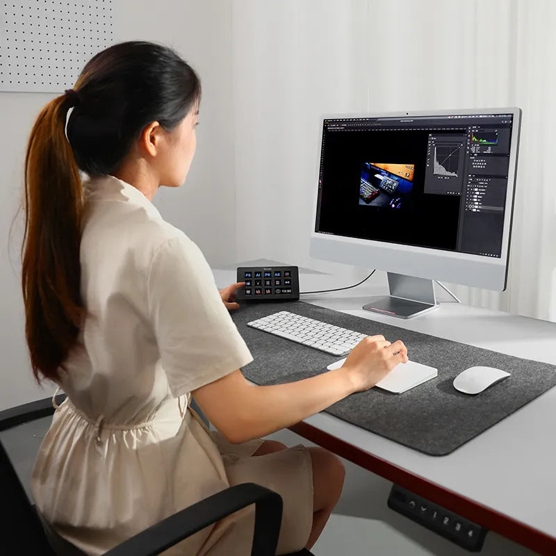 Ulanzi D200 Stream Controller: Content creator using macro keys for video editing with laptop.