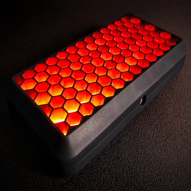 VIJIM VL196 RGB LED video light with honeycomb frame emitting red light.