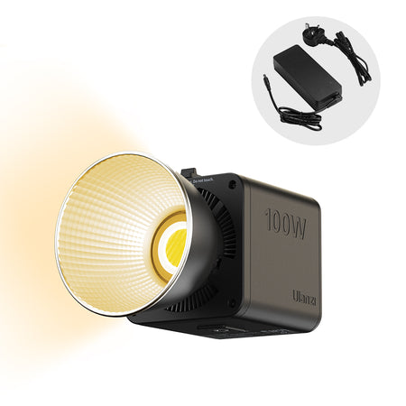 Ulanzi 100W COB video light, featuring warm light and power adapter for content creation.