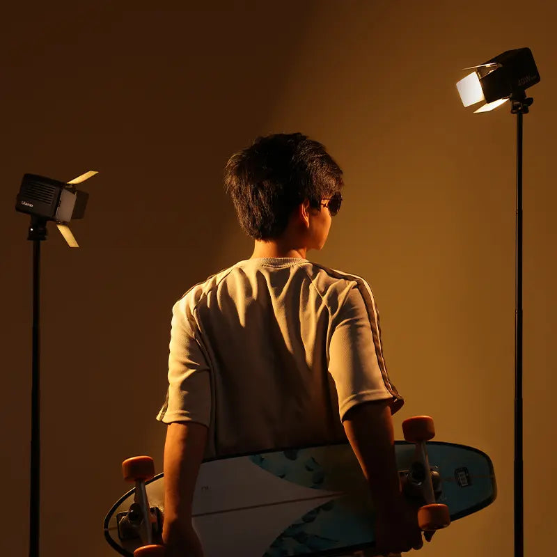 Ulanzi lighting setup with 40W video lights, person with skateboard in a studio setting.