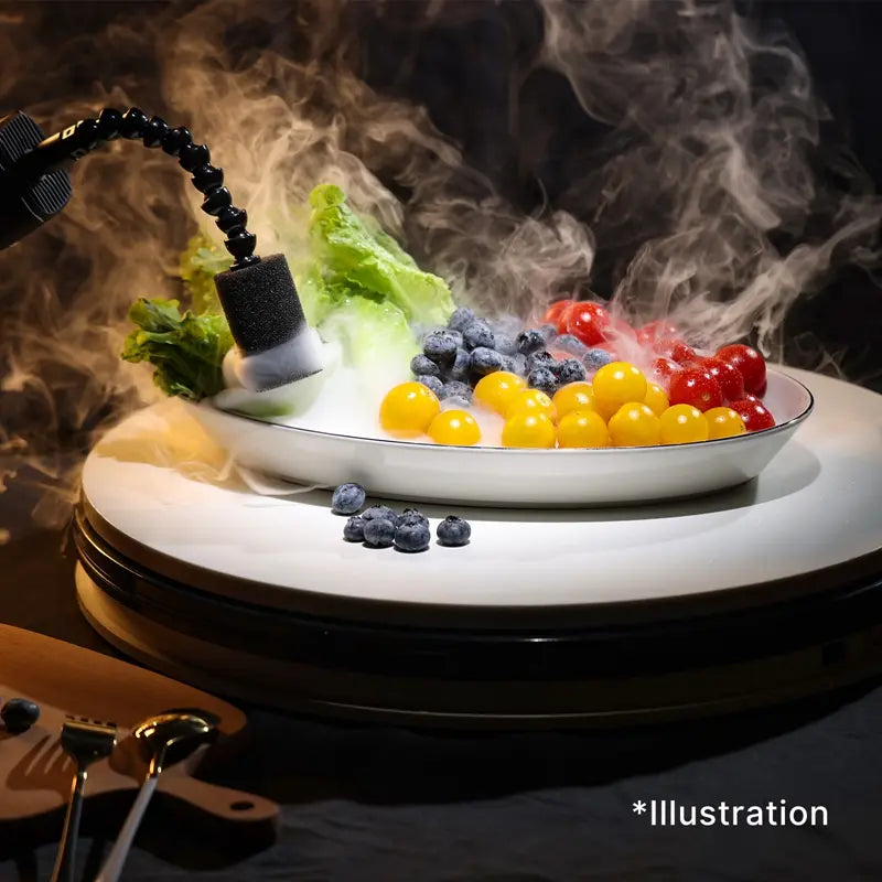 Ulanzi Fog Machine demonstration with fruits and vegetables in a dish, illustration of fog effect.