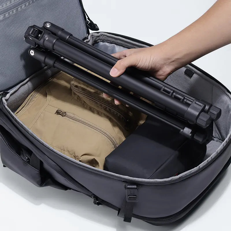Ulanzi TT43 light stand, compact & portable, being packed into a travel bag for photography.