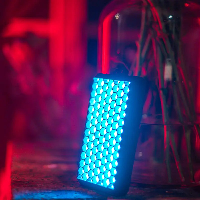VIJIM VL196 RGB LED Video Light with honeycomb frame emitting blue light.