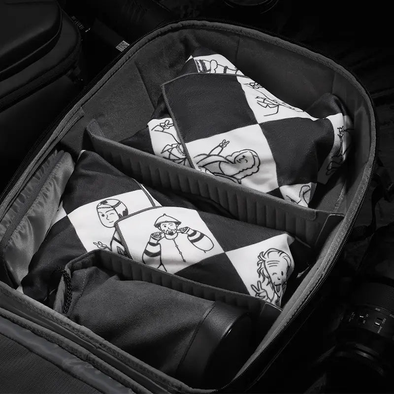 Ulanzi 17-Inch Protective Wrap inside a camera bag, checkered pattern, camera lens protector.
