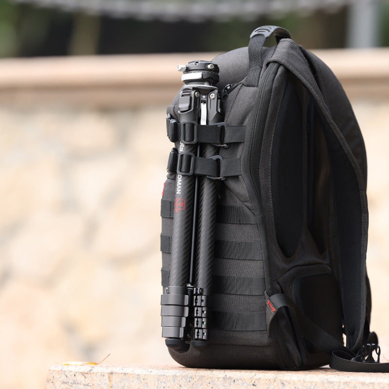 Ulanzi Zero F38 travel tripod attached to backpack, carbon fiber, black, for outdoor photography.