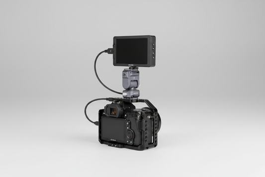 F22 quick-release monitor mount attached to a compact camera rig with a monitor in a studio setting