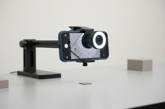 Phone macro lens close-up setup for product photography with a small product detail in focus on a tabletop
