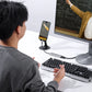 User engaging in video call with Ulanzi C060 capture card connected to monitor.