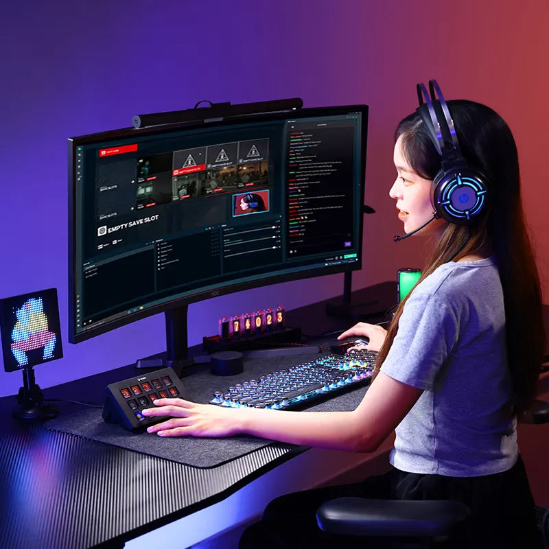 Streamer using Ulanzi Stream Controller D200 with dual monitors and gaming setup.