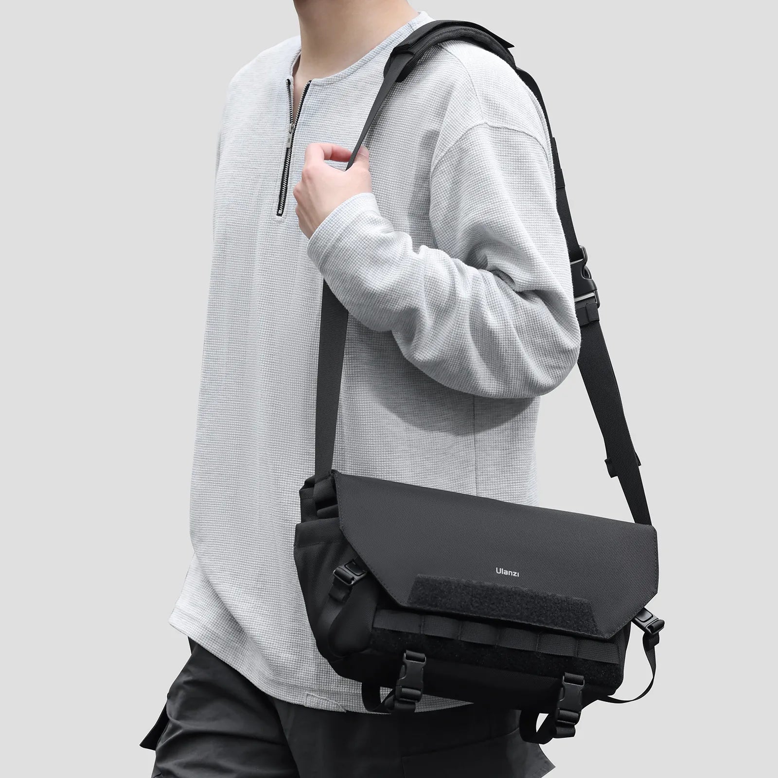 User wearing Ulanzi BC08 camera sling bag with adjustable strap.