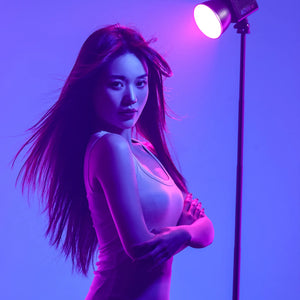 Ulanzi L024 40W RGB LED Video Light, woman with pink lighting, studio shot.
