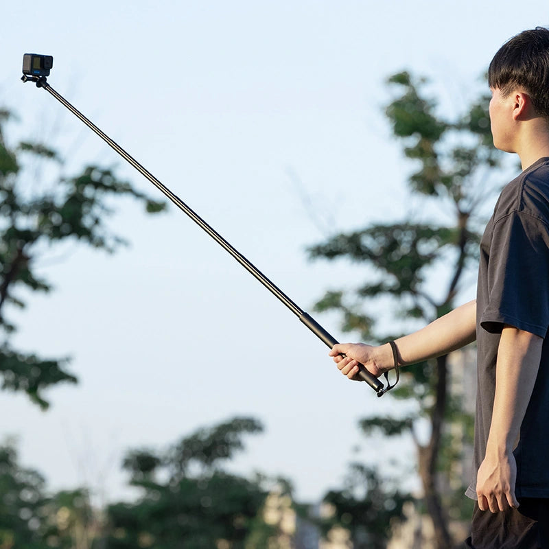 Ulanzi selfie stick pole extended for high angle outdoor photography.