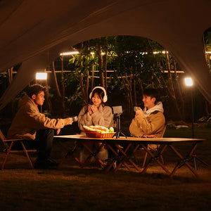 Ulanzi video lights used for outdoor content creation. People using smartphone on tripod at night.