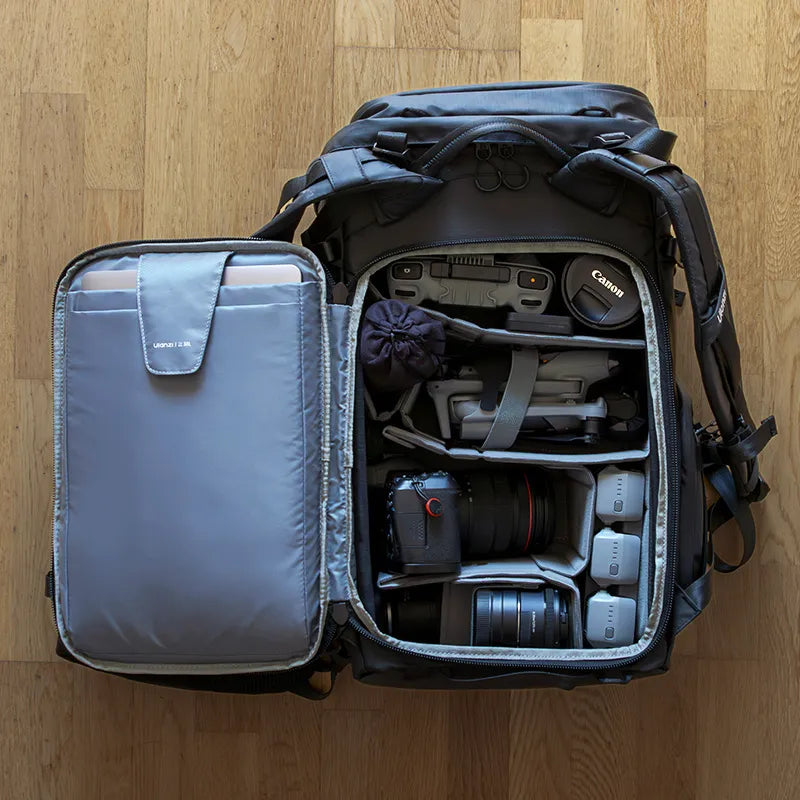 Fully-packed Ulanzi backpack revealing organized camera gear with Canon equipment and custom compartments.