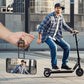 Man riding an electric scooter with a smartphone showing a reflection of him