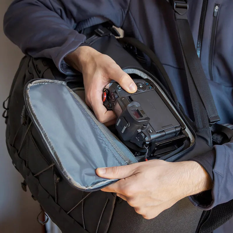 Quick-access camera compartment in Ulanzi backpack for on-the-go photographers.