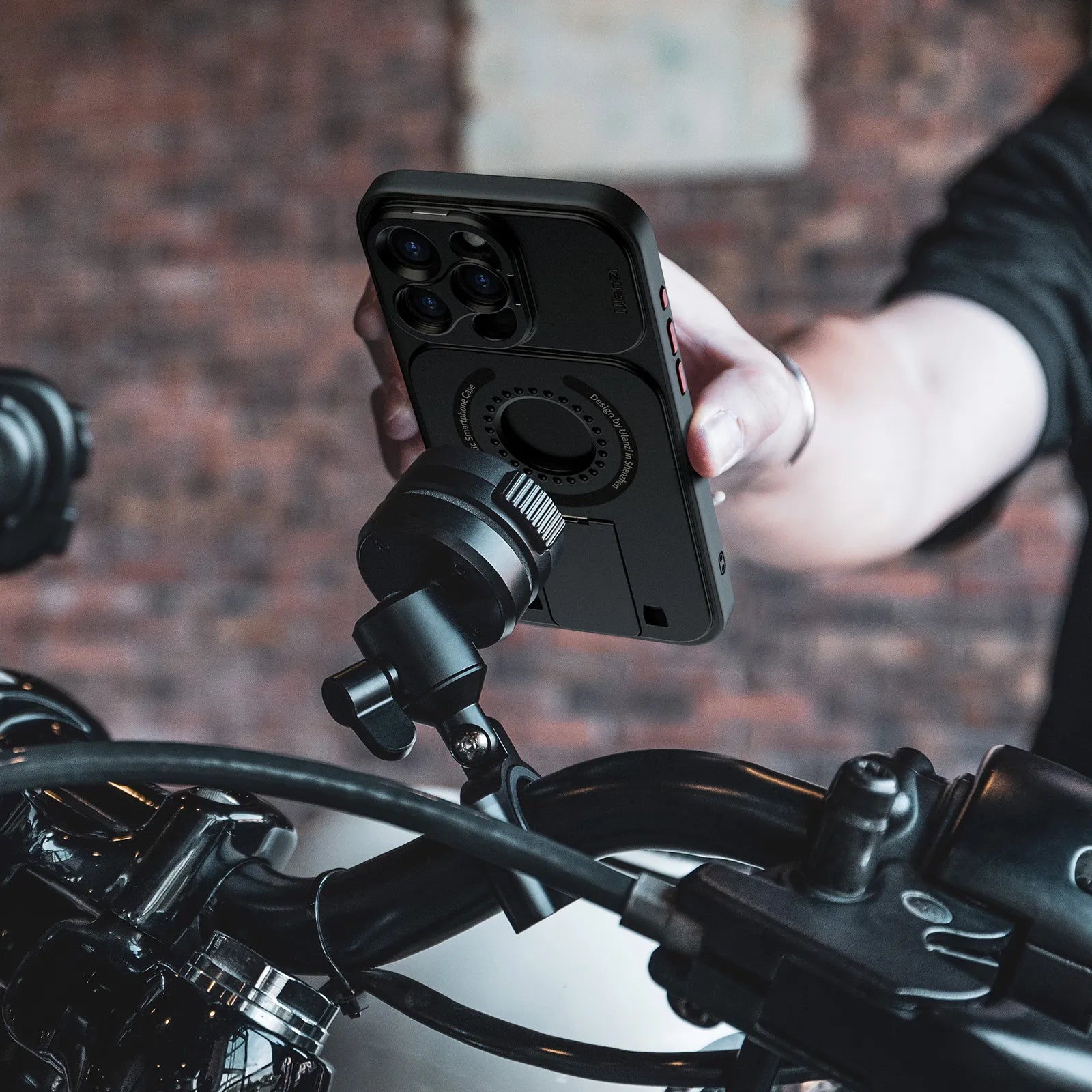Ulanzi O-LOCK Phone Video Kit mounted on motorcycle handlebar with phone attached.