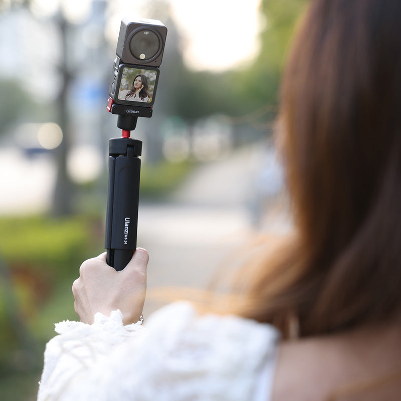 Ulanzi U-170 Magnetic Quick Release Head holding DJI Action Camera on a tripod for action shooting.