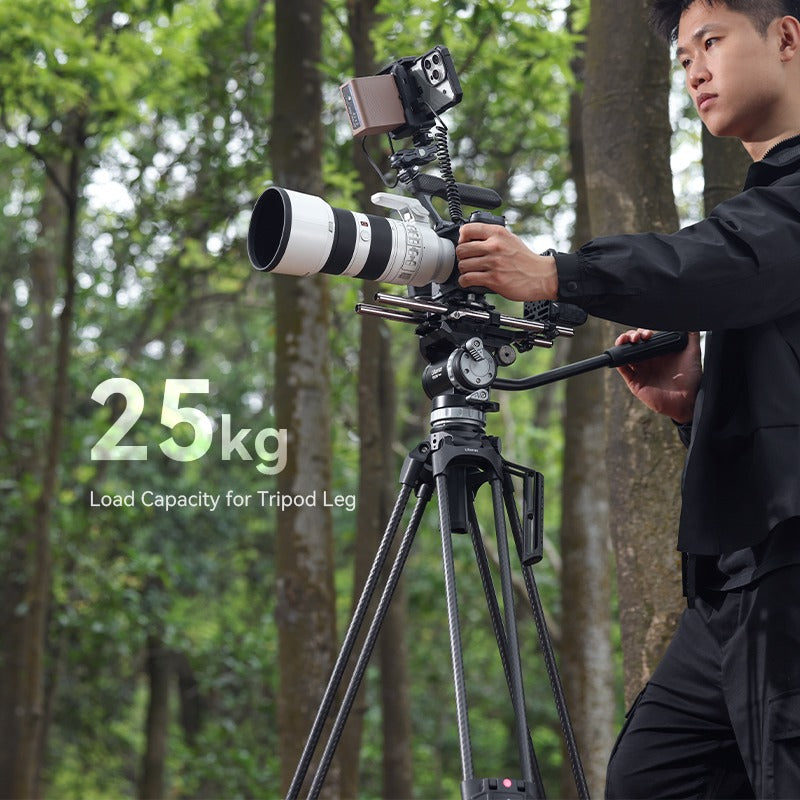 User using Ulanzi VideoFast tripod in a forest with 10kg load capacity