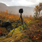 Tripod set up in a scenic autumn landscape.
