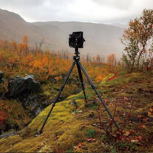 Tripod set up in a scenic autumn landscape.