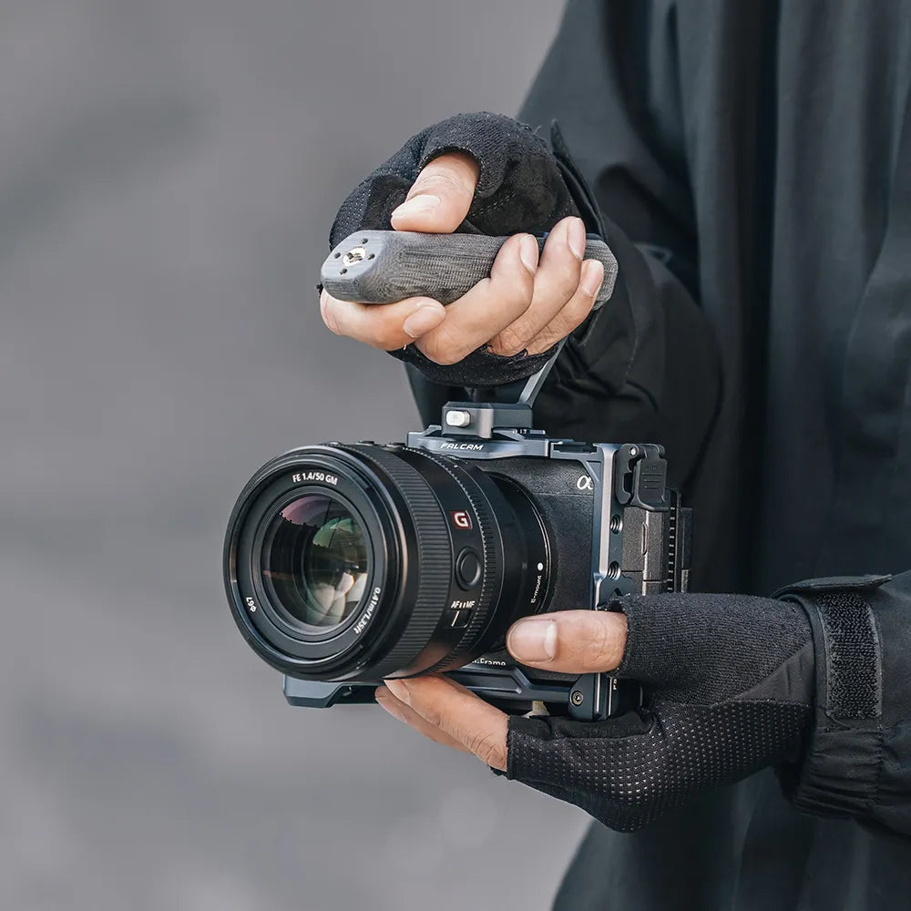 User holding Ulanzi Falcam F22 camera cage with grip for Sony FX30.