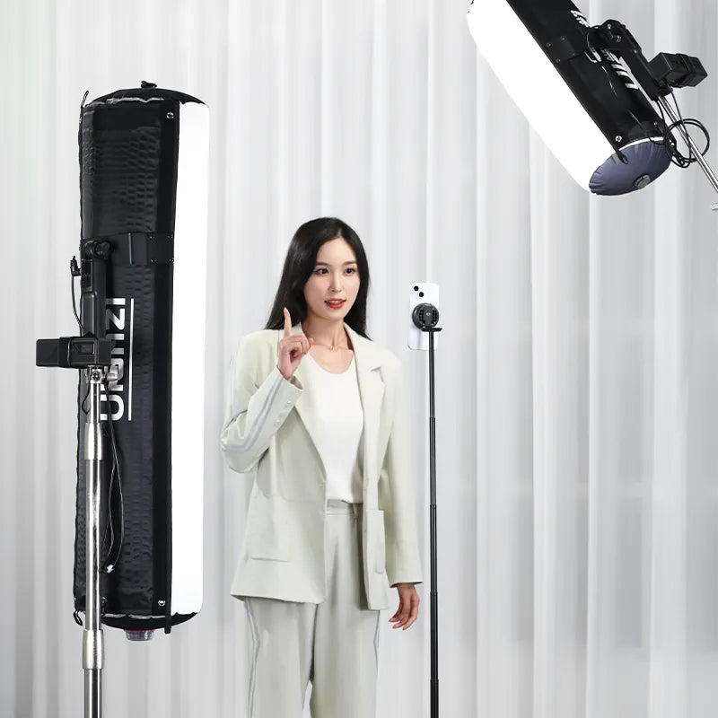 Woman demonstrating Ulanzi AL60 Inflatable LED Light in a professional studio setting.
