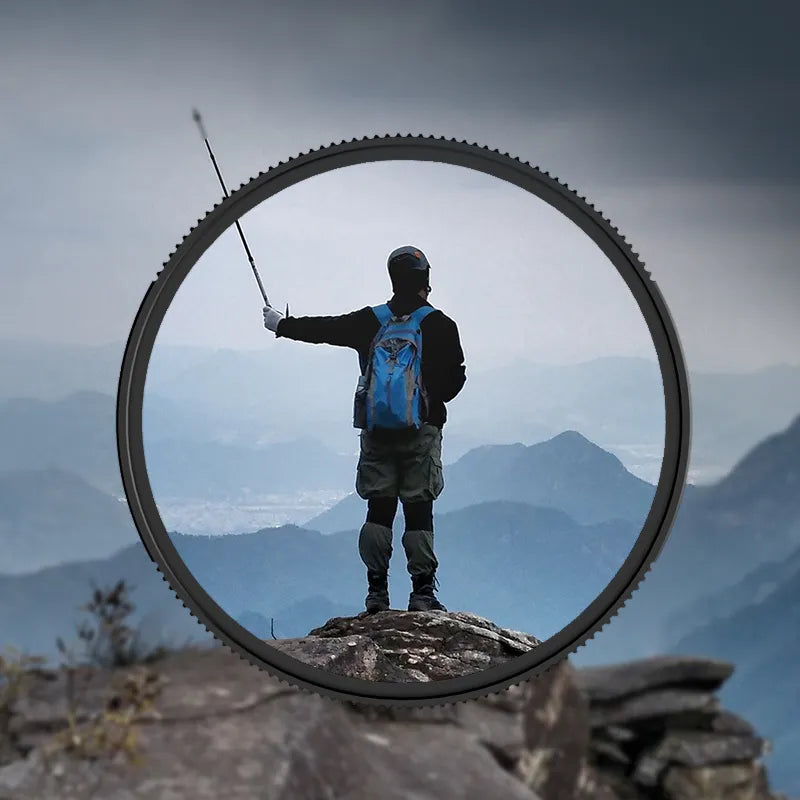 Person with fishing pole on a mountain framed by Ulanzi UV01 UV filter.