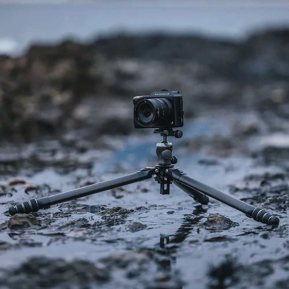 Ulanzi travel tripod on rocky terrain with camera mounted for photography