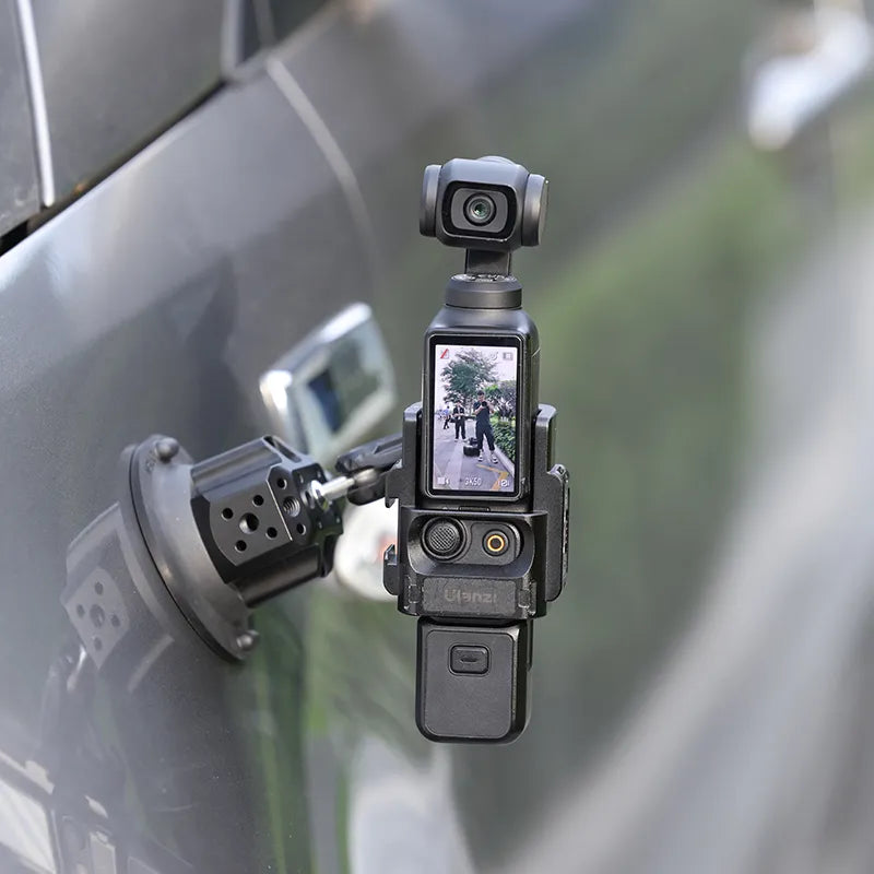 Ulanzi PK-06 adapter for DJI Osmo Pocket 3 mounted on a car for filming.