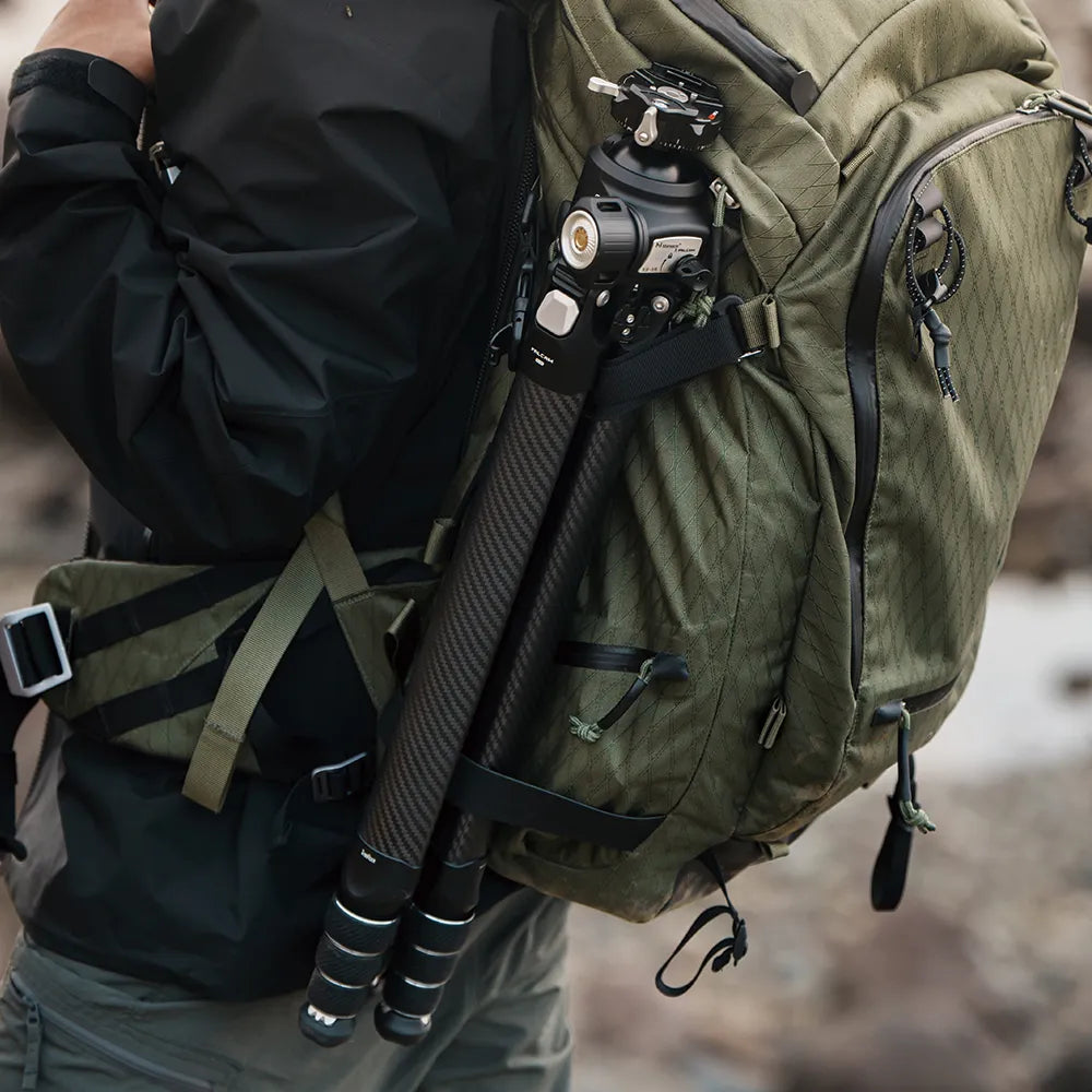 Ulanzi Falcam TreeRoot tripod attached to a backpack for easy transport.