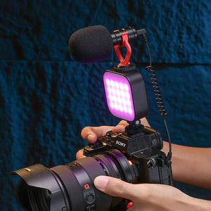 Ulanzi U60 RGB LED light mounted on a camera with a microphone