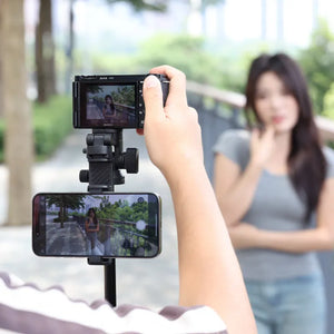 Ulanzi MT-78 Quick-Release Tripod holding a Sony camera and a smartphone capturing a woman's video.