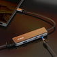 Ulanzi C060 USB-C video capture card with sleek design connected to laptop.