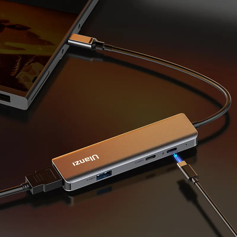 Ulanzi C060 USB-C video capture card with sleek design connected to laptop.