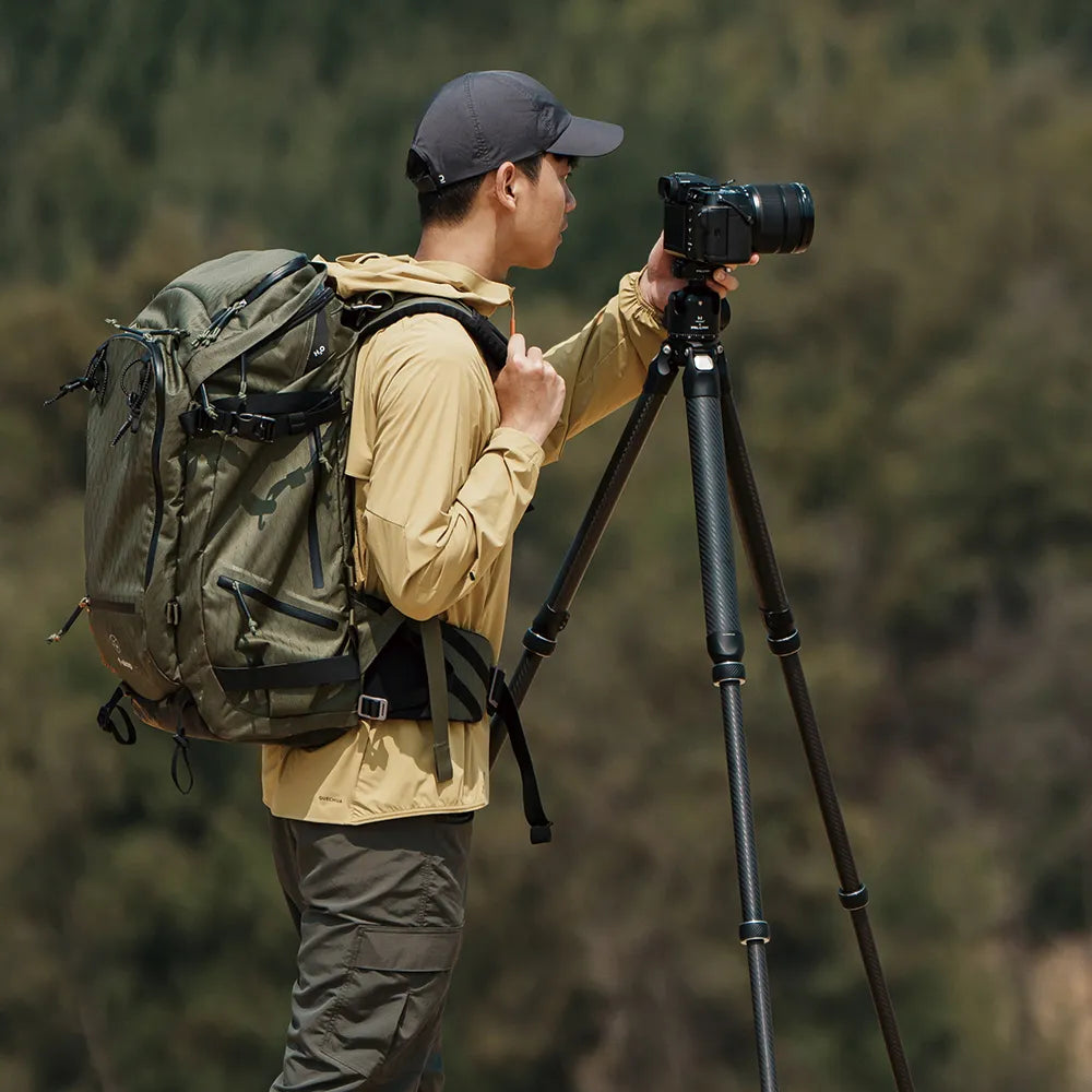Photographer using the TreeRoot Quick Lock Pro Tripod in nature.