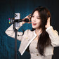 Woman using Ulanzi MA53 phone mount with a microphone for smartphone videography.